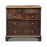 A QUEEN ANNE OAK AND CROSS-BANDED CHEST
EARLY 18TH CENTURY
With two short and three long graduated