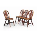 A SET OF FOUR GEORGE III YEW WINDSOR CHAIRS
LATE 18TH CENTURY, THAMES VALLEY
With pierced wheel