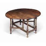 A GEORGE II OAK GATE-LEG TABLE
EARLY 18TH CENTURY
With oval top, spiral legs and square stretchers