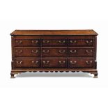 A GEORGE III OAK AND MAHOGANY-BANDED CHEST
LATE 18TH CENTURY, LANCASHIRE
With hinged lid and six