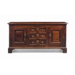 A GEORGE II CHERRY DRESSER
MID 18TH CENTURY
With three twin-panel central drawers flanked by