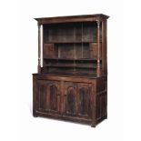 A GEORGE II OAK CANOPY DRESSER
EARLY 18TH CENTURY, NORTH WALES
The two main shelves with plate-rests