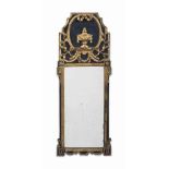 A FRENCH OR ITALIAN EBONISED AND PARCEL-GILT PIER MIRROR
EARLY 19TH CENTURY
The crest centred with