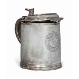 A QUEEN ANNE SILVER TANKARD
MARK OF JOHN GIBBONS, LONDON, 1702
With foliate thumb-piece and short