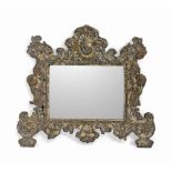 AN ITALIAN SILVERED COPPER REPOUSSE MIRROR
18TH CENTURY
The rectangular plate in a frame decorated