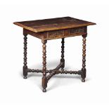 A CHARLES II OAK SIDE TABLE
LATE 17TH CENTURY
The drawer with twin pine panels, ball and reel legs