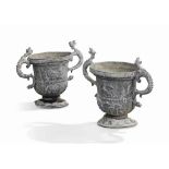 A PAIR OF GEORGE III LEAD GARDEN URNS
MID-18TH CENTURY
Each decorated in relief with cartouches
