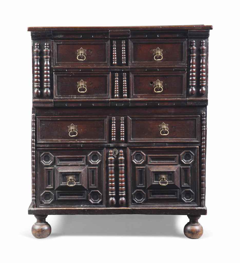 AN OAK CHEST OF DRAWERS
EARLY 18TH CENTURY AND LATER
With four drawers and split-baluster