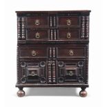 AN OAK CHEST OF DRAWERS
EARLY 18TH CENTURY AND LATER
With four drawers and split-baluster