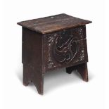 A SMALL OAK CARVED CHEST
EARLY 17TH CENTURY AND ADAPTED
Later carved with a large whirl and