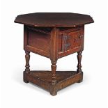 A JAMES I OAK GAMING TABLE
EARLY 17TH CENTURY
Octagonal when open and supported on a loper, with