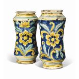 TWO CALTAGIRONE MAIOLICA ALBARELLI
CIRCA 1700
Of waisted form, painted in green, yellow and white