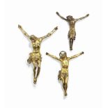 THREE ITALIAN GILT-COPPER ALLOY CRUCIFIX FIGURES
ONE LATE 17TH / EARLY 18TH CENTURY AND TWO PROBABLY