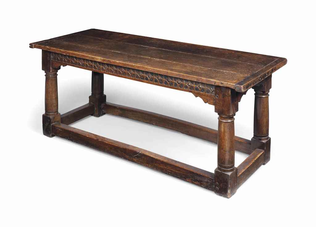 A JAMES I OAK REFECTORY TABLE
EARLY 17TH CENTURY
With three-plank top and strap-work pattern to