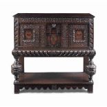 AN OAK AND MARQUETRY LIVERY CUPBOARD
17TH CENTURY AND LATER
Profusely carved overall with strap-work