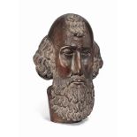 A GOAN OR SPANISH PHILIPPINES HARDWOOD BUST OF SAINT FRANCIS
FIRST HALF 19TH CENTURY
With well