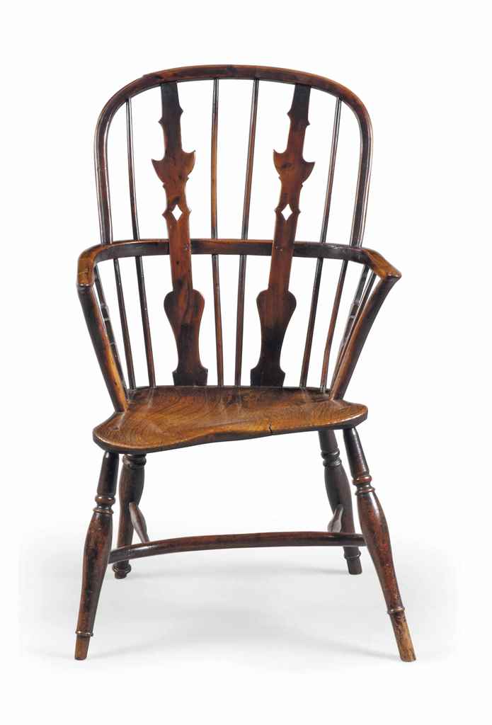 A GEORGE III YEW AND CHERRY WINDSOR ARMCHAIR
LATE 18TH CENTURY, THAMES VALLEY
With unusual shaped