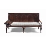 A GEORGE III OAK COACHING SETTLE
LATE 18TH CENTURY, LANCASHIRE
With five arched panels, head-rest to