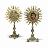 A PAIR ITALIAN BRONZE AND GILT COPPER MONSTRANCES
THE TOPS 18TH CENTURY, THE STEMS LATER
Each oval