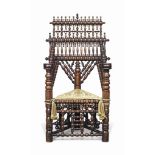 A TURNER'S THRONE CHAIR
SECOND HALF 19TH CENTURY
Cherry and walnut, with multiple tiers of turned