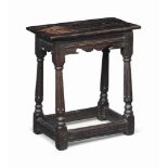 A JAMES I OAK JOINED STOOL
EARLY 17TH CENTURY
The associated top above channel-moulded and ogee