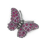 A ruby, pink sapphire and diamond butterfly brooch
The brilliant-cut diamond body and antennae to