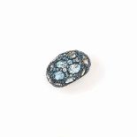 A blue topaz 'Tabou' ring, by Pomellato
Of bombé design, set to the front with oval-cut blue topaz