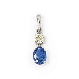 An 18ct white gold sapphire and diamond pendant
The oval-cut sapphire and old brilliant-cut