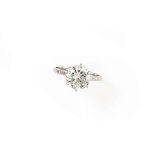 A diamond single stone ring
The brilliant-cut diamond in claw mount to a plain hoop, finger size N½