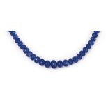 A tanzanite bead necklace
The graduated row of flattened tanzanite beads to a diamond-set clasp,