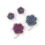 A pair of ruby, sapphire and diamond-set earrings and brooches
Each of flowerhead design, the