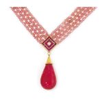 A pink tourmaline, ruby and diamond necklace and bracelet, by Jahan
The necklace with pear shaped