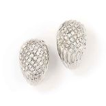 A pair of diamond earrings, by Boucheron
Each drop-shaped earring with curved reeded decoration