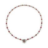 A ruby and diamond necklace
Composed of a graduated line of alternating cabochon ruby collets and