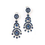 A pair of sapphire 'Ava' earrings, by Boucheron
Each circular-cut sapphire and sapphire circlet