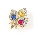 A vari-coloured sapphire and diamond ring
Of pavé diamond foliate design, set with three oval-cut