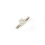 A diamond single stone ring
The brilliant-cut diamond within a six-claw mount, to the plain hoop,