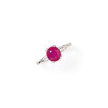 A ruby and diamond ring
The oval-cut ruby, weighing approximately 1.79 carats, between tapered