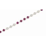 A RUBY AND DIAMOND-SET BRACELET, BY CHATILA
Each bombé link pavé set with brilliant-cut brown