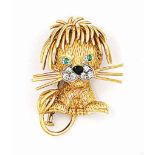 A GEM-SET LION BROOCH, BY VAN CLEEF & ARPELS
The textured lion with pavé-set diamond muzzle, black