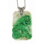 A CHINESE JADEITE JADE AND DIAMOND PENDANT NECKLACE
The rectangular carved jadeite plaque pendant