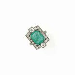 AN EARLY 20TH CENTURY EMERALD AND DIAMOND RING
The cushion-cut emerald within an old brilliant-cut