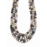 A NATURAL PEARL NECKLACE
Comprising three rows of 132, 122 and 114 graduated natural pearls of