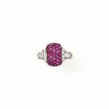 A RUBY AND DIAMOND DRESS RING, BY CHATILA
The bombé centre pavé-set with rubies between baguette-cut