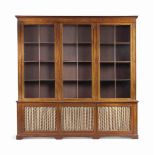 A REGENCY LINE-INLAID MAHOGANY LIBRARY BOOKCASE
EARLY 19TH CENTURY
The cornice above three