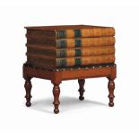 A FRENCH BIRCH AND LEATHER LOW TABLE
19TH CENTURY
In the form of a stack of books on a stand with