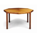 A TEAK OCTAGONAL DINING-TABLE
THIRD QUARTER 20TH CENTURY
The radial top on turned legs and block