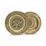 A NUREMBERG BRASS ALMS DISH
16TH CENTURY
Decorated with raised stylised flower-heads and a band of
