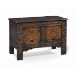 A SMALL CHARLES I OAK AND FLORAL MARQUETRY CHEST
MID 17TH CENTURY, GLOUCESTERSHIRE
With stiff-leaf