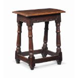 A CHARLES I OAK JOINED STOOL
MID 17TH CENTURY
With incised and gouge-decorated friezes, on turned